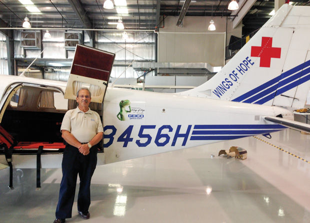 Dick Horowitz standing next to one of the Wings of Hope planes. Photo: Rebecca Ferman