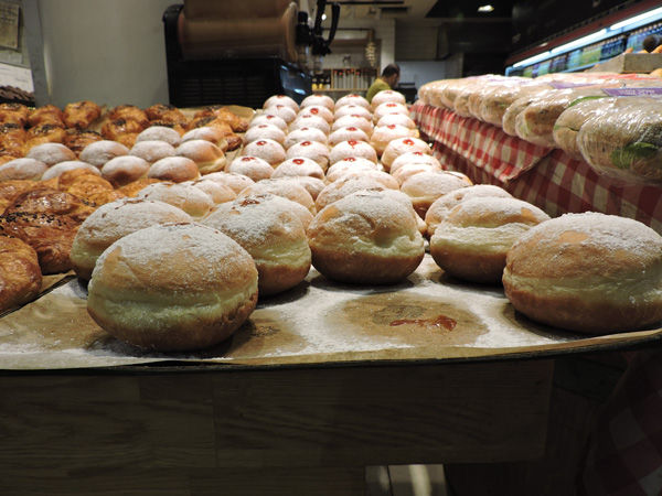 Sufganiyot%2C+a+Hanukkah+favorite+in+Israel%2C+on+display+in+Jerusalem%E2%80%99s+Central+Bus+Station.+The+jelly+doughnut+is+appearing+in+bakeries+across+the+country+more+than+a+month+before+the+holiday.+Photo%3A+Ben+Sales