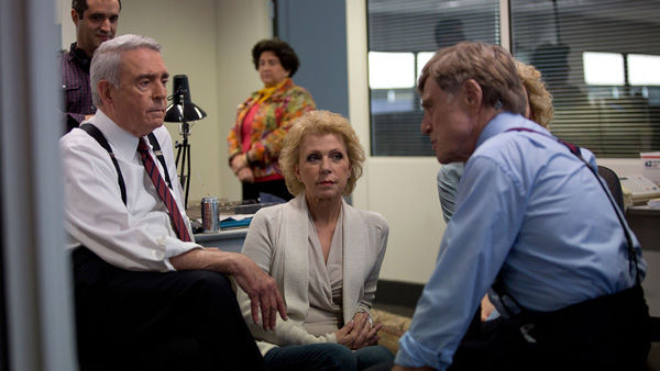 Dan Rather (left) and his former producer Mary Mapes (center) speak with Robert Redford on the set of ‘Truth.’