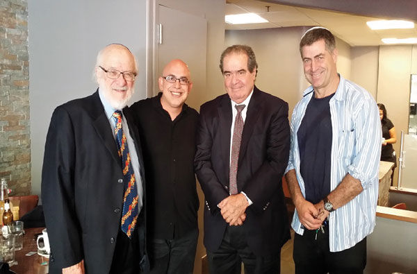 From left, Nathan Lewin, Sima Soumekhian, Supreme Court Justice Antonin Scalia and Marc Zweben at the Char Bar in Washington, D.C., the kosher restaurant owned by Soumekhian and Zweben, May 2015.