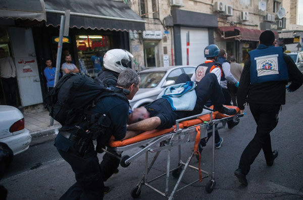 Israeli+personnel+respond+to+a+shooting+attack+in+Jerusalem%2C+March+8.%C2%A0+Photo%3A+Yonatan+Sindel%2FFlash+90