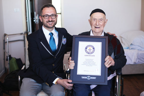 Marco+Frigatti%2C+head+of+records+for+Guinness+World+Records%2C+presents+Israel+Kristal+his+certificate+of+achievement+for+Oldest+living+man%2C+in+Haifa%2C+Israel+on+March+11.
