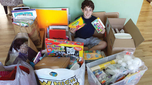 Noah Freeman, with arts and crafts items he collected for the children of the Kathy J. Weinman Women’s Shelter. 