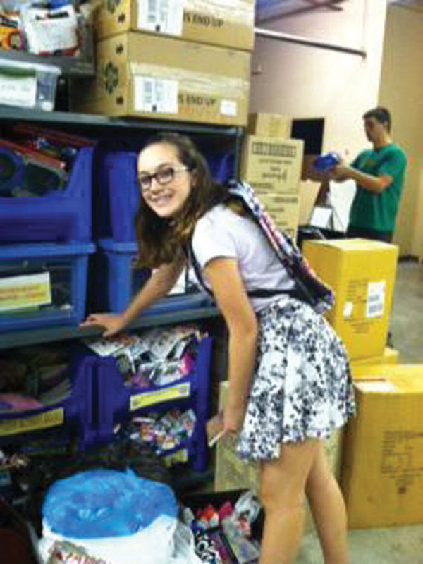 For her mitzvah project, Sara Marks collected items and filled 20 backpacks for Project Backpack, which  ‘provides area police departments, social service agencies, domestic violence shelters and Department of Family Services workers with backpacks filled with necessities and comfort items,’ according to the group’s website. 