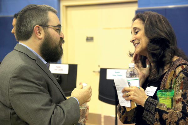 Rabbi Levi Landa of Chabad of Greater St. Louis  and Rabbi Susan Talve of Central Reform Congregation talk at an event on pluralism in the Jewish community, held at Saul Mirowitz Jewish Community School last week. Photo: Philip Deitch