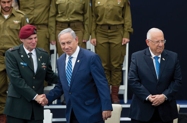 Israeli+Prime+Minister+Benjamin+Netanyahu%2C+center%2C+shaking+hands+with+Israel+Defense+Forces+Deputy+Chief+of+Staff+Yair+Golan%2C+left%2C+alongside%C2%A0President+Reuven+Rivlin%2C+right%2C+at+a+ceremony+for+outstanding+soldiers+on+Israel%E2%80%99s+Independence+Day%2C+May+12%2C+2016.+%28Yonatan+Sindel%2FFlash90%29