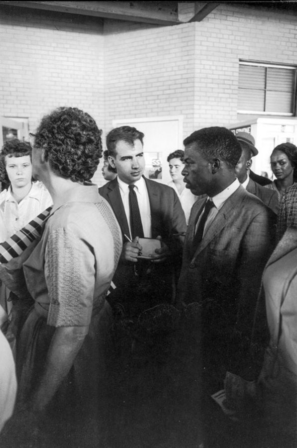 Writer Calvin Trillin, center, interviewing John Lewis in Birmingham, Ala., as the Freedom Riders were boarding the bus for Montgomery in 1961. Photo: LIFE Images Collection