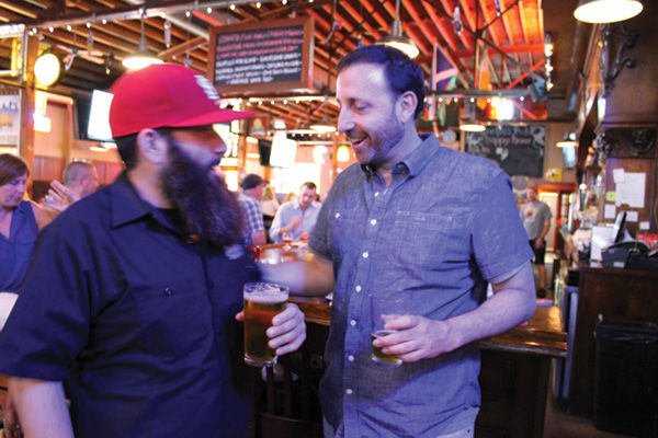 Shmaltz Brewing Company founder Jeremy Cowan (right) and Jeff Doerr, a sales manager, sip some of the He’Brew beers on July 8 at Llywelyn’s Pub in Webster Groves. Photo: Eric Berger