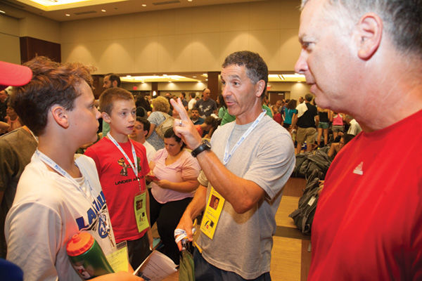 JCC Maccabi Games coach Jim Greenstein greets athletes during a meeting for players and parents on Sunday at the Jewish Community Center. Photo: Andrew Kerman