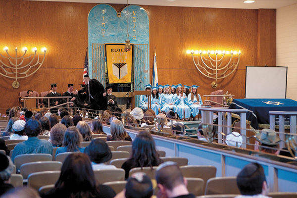 Rabbi Amiel Rosenbloom congratulates students at the Block Yeshiva High School commencement ceremony in 2010. File photo: Lisa Mandel