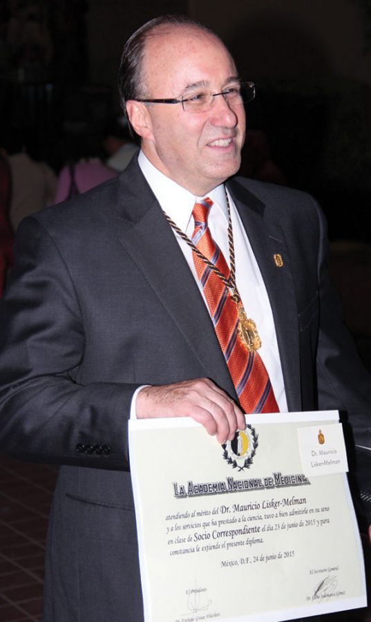 Dr. Mauricio Lisker-Melman receives a medal and diploma as a new member of the National Academy of Medicine in Mexico City, in June 2015.