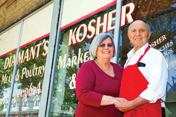 Irving and Kay Diamant in front of their store in 2011.