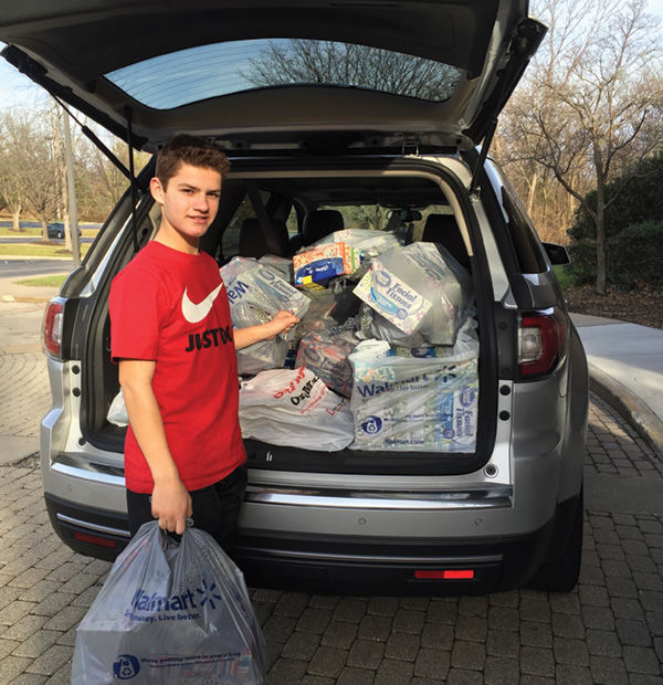 Blake Silverman loading goods for NCJW’s Back to School! Store.