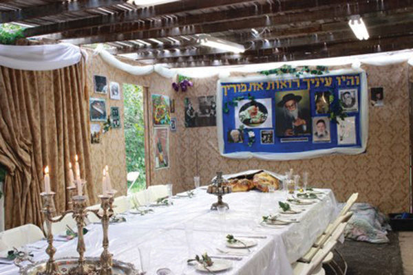 Mordecai and Tzipporah Yaroslawitz hosted between 35 and 60 people for meals throughout Sukkot at their home in University City. Photo courtesy of Mordecai Yaroslawitz