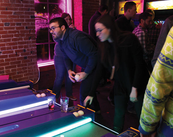 More than 200 people showed up to LollapaJEWza on the first night of Hanukkah and Christmas Eve at Start Bar in downtown St. Louis. Above, Skee-Ball proved to be the most popular game among the Jews in their 20s and 30s. Photo: Eric Berger