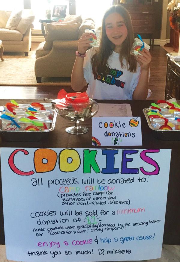 Mikaela Snitzer sells cookies to benefit Camp Rainbow.