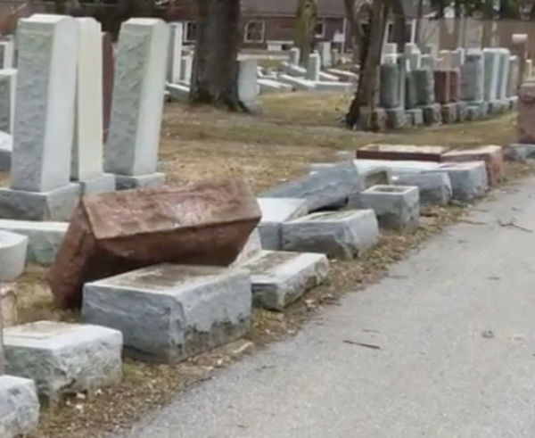 A row of toppled headstones at Chesed Shel Emeth Cemetery on Monday evening. Photo: Eric Berger