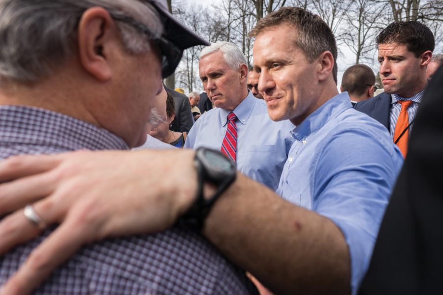 Missouri Gov. Eric Greitens greets volunteers at Chesed Shel Emeth Cemetery in February. After news broke about vandalism at the cemetery, Greitens called for volunteers to gather at the cemetery to work on cleanup efforts. To the left of Greitens is Vice President Mike Pence.  Photo: James Griesedieck