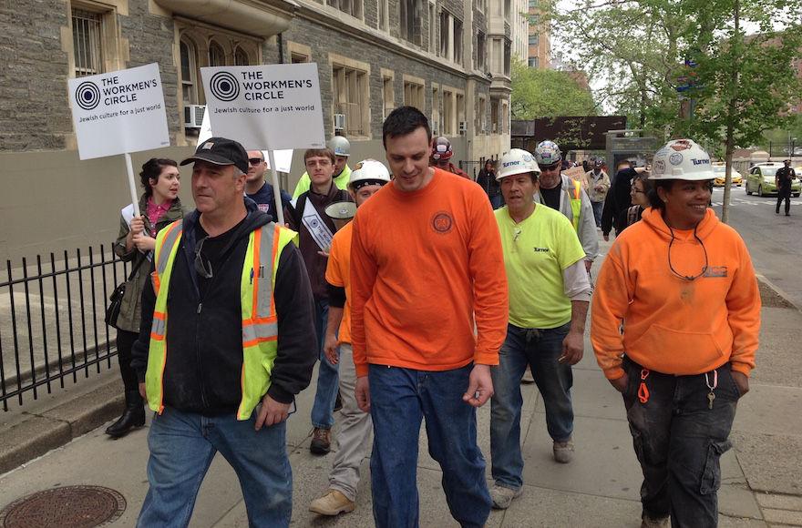 Marchers protesting labor arrangements at the Jewish Theological Seminary’s construction site in New York City say the building contractor violates workers’ rights, May 1, 2017. (Ben Sales)