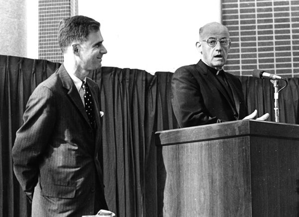 Julian I. Edison, then executive vice president of Edison Brothers Stores Inc., listens as the Rev. Paul C. Reinert, S.J., president of St. Louis University, reads the text of a citation presented to Mr. Edison in 1968, when he received the university’s Sesquicentennial Award for his work as a founder and the first president of the Associates of St. Louis University Libraries.