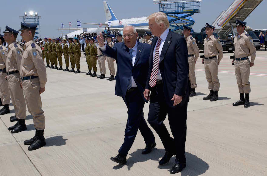 Israeli President Reuven Rivlin guiding President Donald Trump at Ben Gurion Airport near Tel Aviv, May 22, 2017. (Avi Ohayon/Israeli Government Press Office/Flash90)