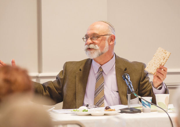 Rabbi Josef Davidson speaks at a 2015 Hunger Seder held by the Jewish Community Relations Council. 