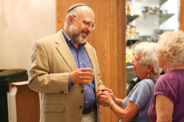 Rabbi Hyim Shafner says goodbye to community members during a gathering Sunday at Bais Abraham Congregation in University City.Photo: Bill Motchan