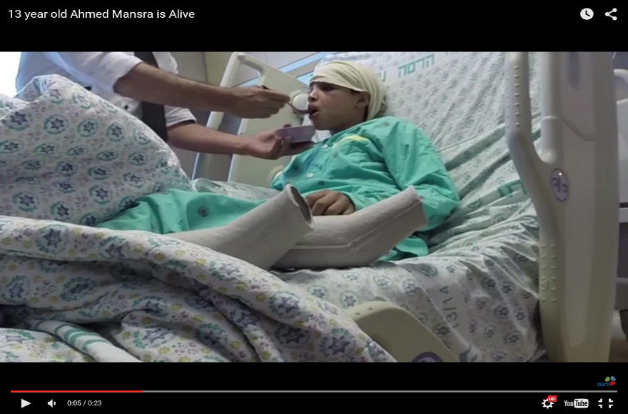 Israel releases a video of Ahmed Mansra, 13, eating in his hospital bed at Hadassah Hospital after Palestinian Authority President Mahmoud Abbas accused Israel of ‘executing’ him. (Courtesy GPO)