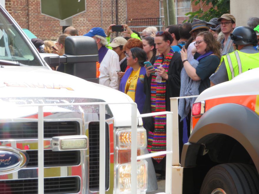 Clergy pray at the scene where a car ran into counterprotesters in Charlottesville Va. who were protesting white supremacists gathered in the city on August 12 2017. (Ron Kampeas)