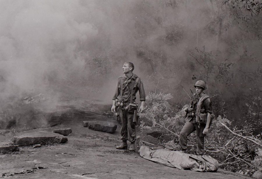 U.S. troops watch over a body.Photo: The Vietnam War via PBS, © The Vietnam Film Project LLC