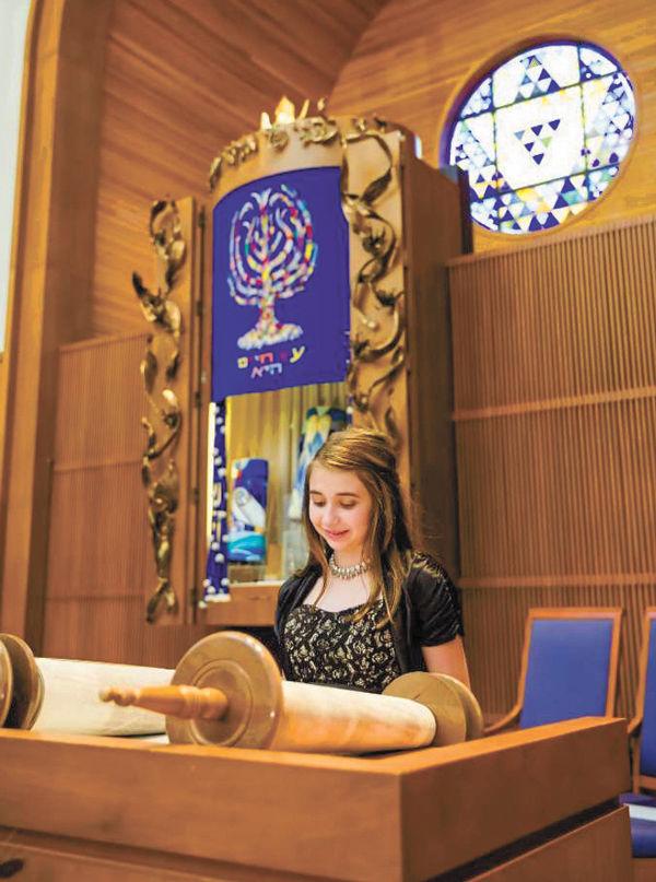 Marquette senior Sydney Ring reads from the Torah at her bat mitzvah at United Hebrew.  Photo courtesy of Sydney Ring