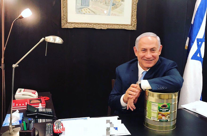 Prime+Minister+Benjamin+Netanyahu+posing+with+a+large+can+of+pickles%2C+Oct.+23%2C+2017.+%28Courtesy+of+Prime+Minister%E2%80%99s+Office%29