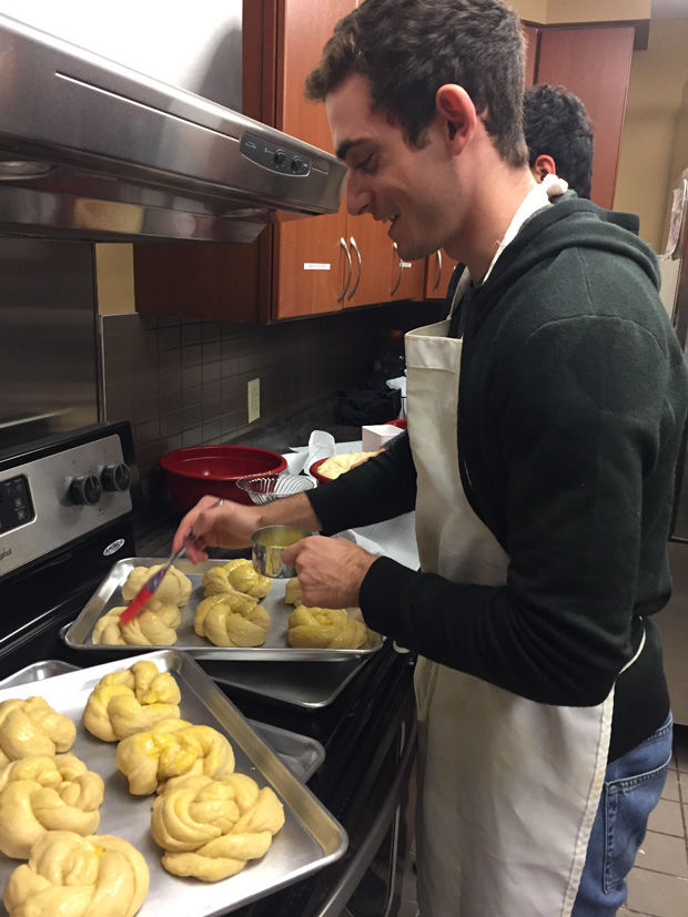 Jeremy+Robbins%2C+a+WashU+junior+and+member+of+Challah+for+Hunger%2C+prepares+challah+in+the+Hillel+kitchen+for+many+of+the+Shabbat+Around+WashU+dinners.