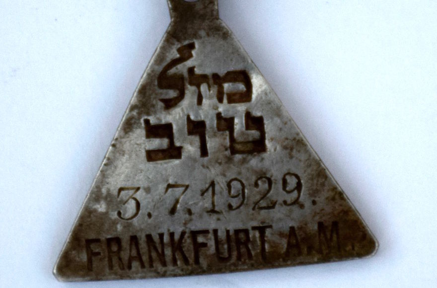A pendant found at an excavation of the Nazi death camp in Sobibor, Poland, was identified as belonging to Karoline Cohn, a Jewish girl from Frankfurt, Germany, who is not known to have survived the war. (Yoram Haimi and Wojciek Mazurek)