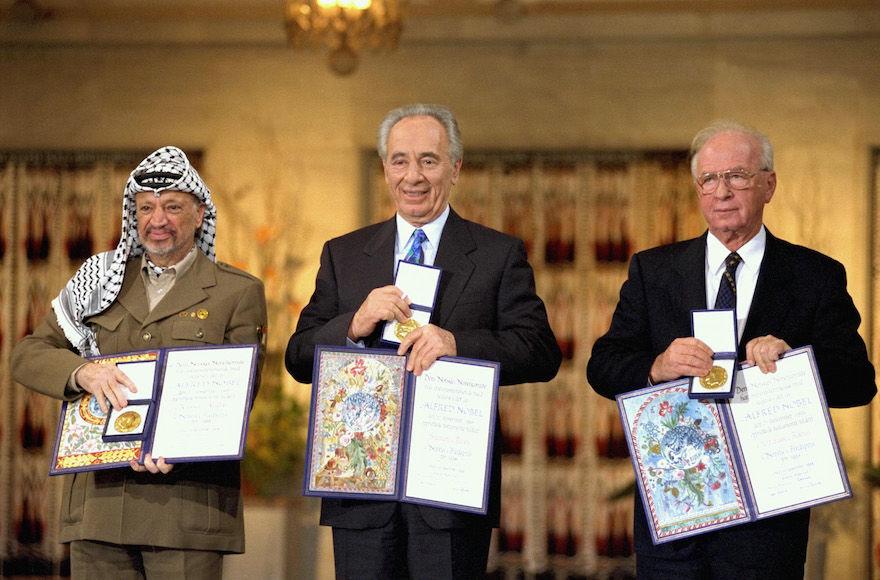 From left to right: Yasser Arafat, Shimon Peres and Yitzhak Rabin in 1994 after winning the Nobel Peace Prize for their roles in the Oslo Accords. (Wikimedia Commons)
