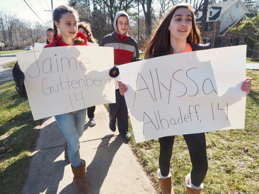During the National School Walkout on March 14, Saul Mirowitz Jewish Community School eighth graders Halle Wasserman, Idan Lerner and Ellior Rose hold signs with names of teens killed in the Feb. 14 school shooting at Marjory Stoneman Douglas High School in Parkland, Fla.