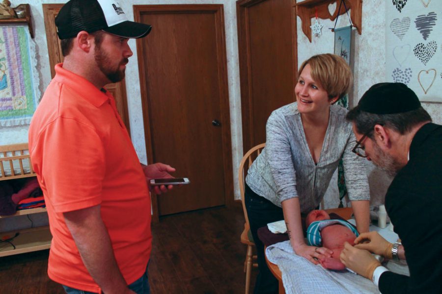 Tiffany and Rodd Norris drove more than four hours from a farm in Kansas to have Rabbi Mike Rovinsky perform a circumcision on their newborn son. Photo: Eric Berger