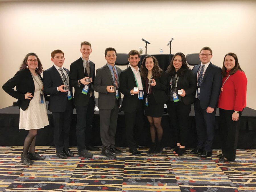 Executive board members of Washington University Israel Public Affairs Committee (WIPAC) pose with their awards after their chapter received the AIPAC 2018 “Campus Activist of the Year” Award. From left are WashU Hillel Assistant Director and WIPAC Advisor Miriam Ross-Hirsch, Geordan Neinstein, Micah Goldson, President Nate Turk, Jacob Scheinman, Kayla Steinberg, Immediate Past President Hannah Sinrich, former President and current AIPAC staffer Daniel Grey and WashU Hillel CEO, Jackie Levey.