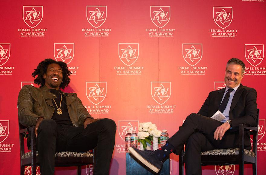 Amar’e Stoudemire, left, speaking with Jon Frankel at the Israel Summit at Harvard University in Cambridge, Mass., April 8, 2018. (Collin Howell/Israel Summit at Harvard)