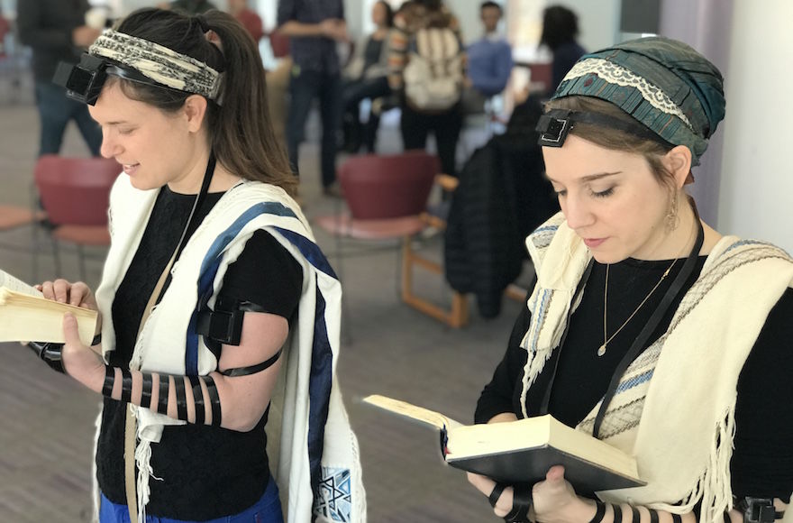 Rabbinical+students+at+Hebrew+College+near+Boston%2C+including+Gita+Karasov%2C+left%2C+are+creating+a+video+that+shows+women%2C+transgender+and+non-binary+Jews+demonstrating+how+to+wear+tefillin.+%28Dena+Trugman%29