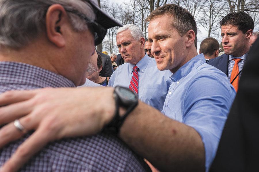 Missouri Gov. Eric Greitens greets volunteers at Chesed Shel Emeth Cemetery in February, 2017. After news broke about vandalism at the cemetery, Greitens called for volunteers to gather at the cemetery to work on cleanup efforts. Now, the governor is facing widespread calls for his resignation. File Photo: James Griesedieck