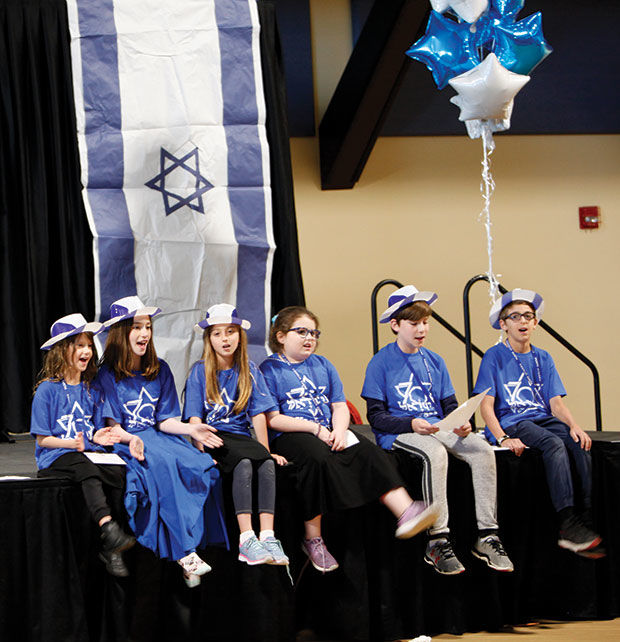 Jewish+day+school+students+from+Epstein+Hebrew+Academy+and+Saul+Mirowitz+Jewish+Community+School+came+together+at+the+Jewish+Community+Center%E2%80%99s+Staenberg+Family+Complex+for+the+annual+Yachad+event%2C+planned+by+Torah+Mitzion+Kollel.+Students+from+Yeshivat+Kadimah+High+School+assisted+in+the+event%2C+which+is+held+in+honor+of+Yom+Ha%E2%80%99atzmaut%2C+Israel%E2%80%99s+Independence+Day.+Groups+of+students+went+through+different+stations+and+booths+to+learn+about+Israel+through+a+variety+of+activities.+The+students+then+gathered+in+the+gymnasium+for+a+closing+event+and+%E2%80%9CDaglanot%2C%E2%80%9D%C2%A0+a+flag+march.+At+one+booth%2C+children+made+fleece+blankets+that+will+be+shipped+and+given+out+to+%E2%80%9Cat+risk%E2%80%9D+kids%C2%A0+from+St.+Louis%E2%80%99+sister+city%2C+Yokneam-Megiddo.%C2%A0+Photos%3A+Mike+Sherwin
