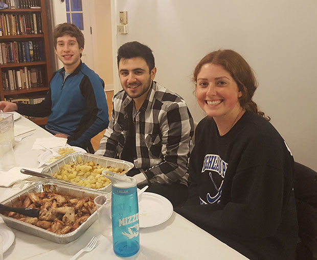 Students enjoy a Kosher for Passover dinner at Mizzou Chabad. Each night throughout Passover Chabad at Mizzou offered Kosher for Passover dinners.Pictured from left: Chase Feldman, Josh Max and Sarah Lehman.