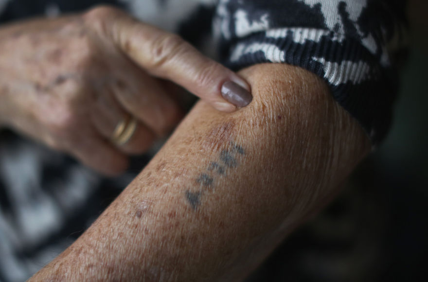 Auschwitz+and+Belsen+concentration+camp+survivor+Eva+Behar+showing+her+number+tattoo+in+her+home+in+London%2C+Dec.+1%2C+2014.