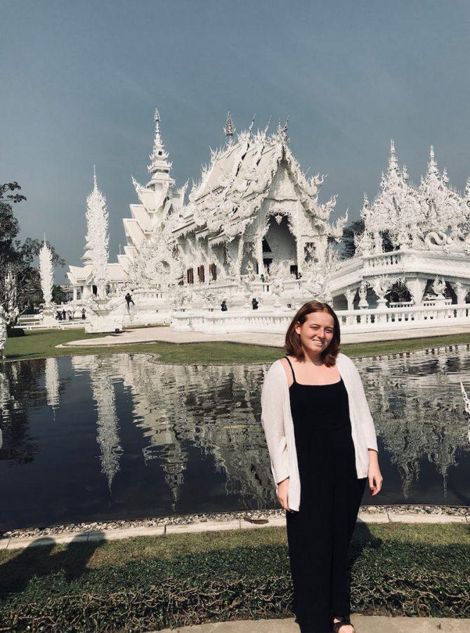 (Left) Zoe Schuver at Wat Rong Khun, also called the White Temple in Chiang Rai, Thailand. “I live in an area that has a Chinese influence and there are a lot of Chinese Buddhism temples around here,” Schuver said. Photo courtesy of Schuver