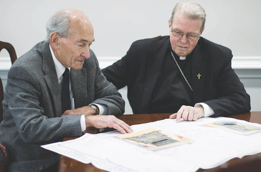 Michael Lozman, left, and Bishop Edward Scharfenberger going over plans for an interfaith Holocaust memorial outside Albany, N.Y. (Jewish Standard)