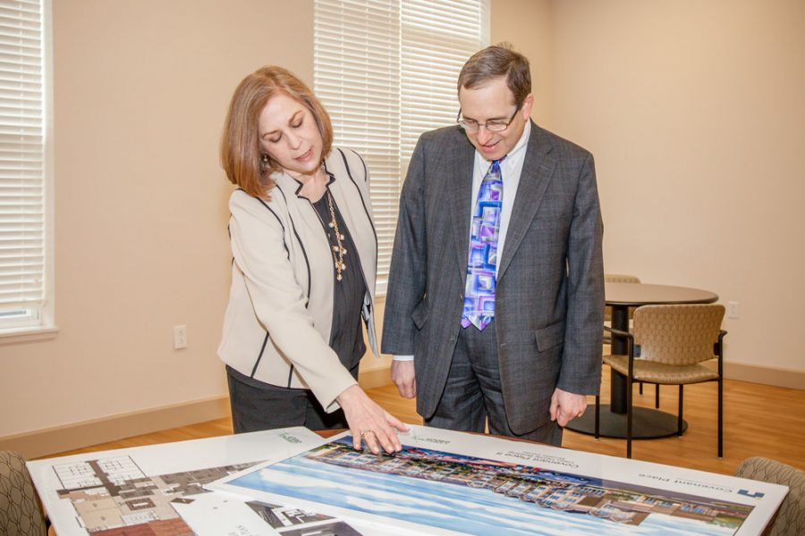 Steve Gorin and Covenant Place Executive Director Joan Denison look at plans for Covenant’s new building project.