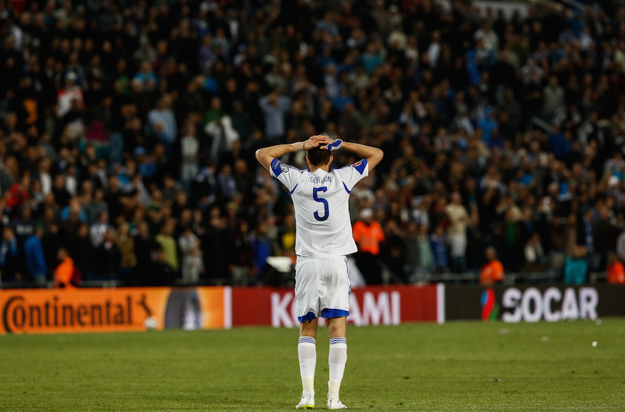 Rami Gershon of the Israel national soccer team reacts after a Euro 2016 qualifying match against Belgium at Teddy Stadium in Jerusalem, March 31, 2015. (Yonatan Sindel/Flash90)
