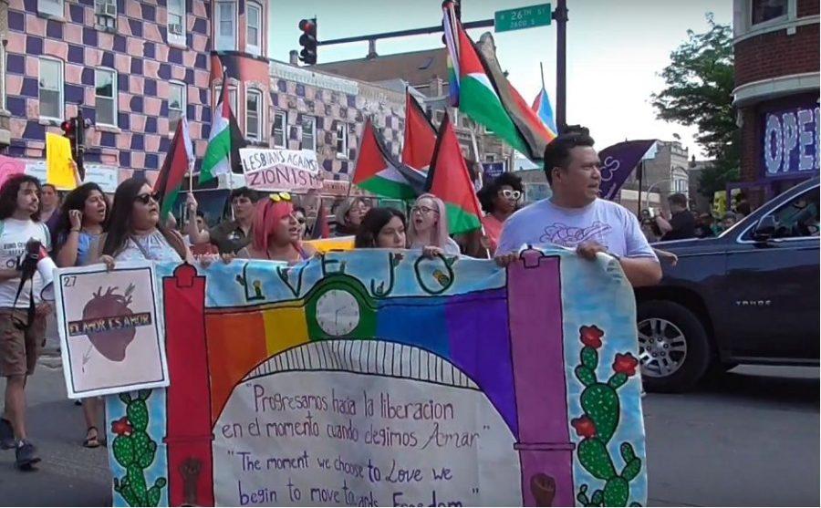 Participants+in+the+2018+Chicago+Dyke+March+waving+Palestinian+flags.+%28Screenshot+of+Windy+City+Times+video%29