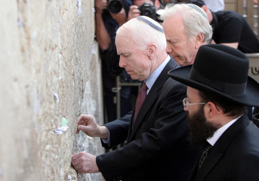 U.S.+Sens.+John+McCain+and+Joseph+Lieberman%2C+right%2C+place+notes+in+the+Western+Wall+in+Jerusalem+on+March+19%2C+2008.+Photo%3A+Brian+Hendler